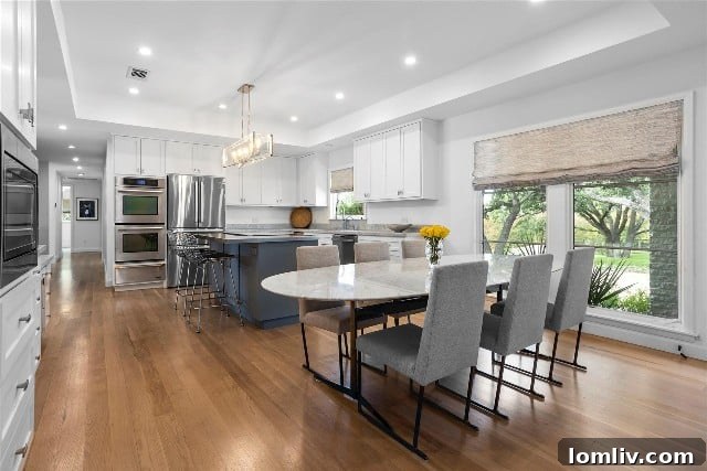 Warm and inviting modern kitchen with floor-to-ceiling windows.