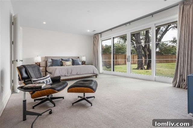 Spacious primary suite with pool access in a Fort Worth luxury home.