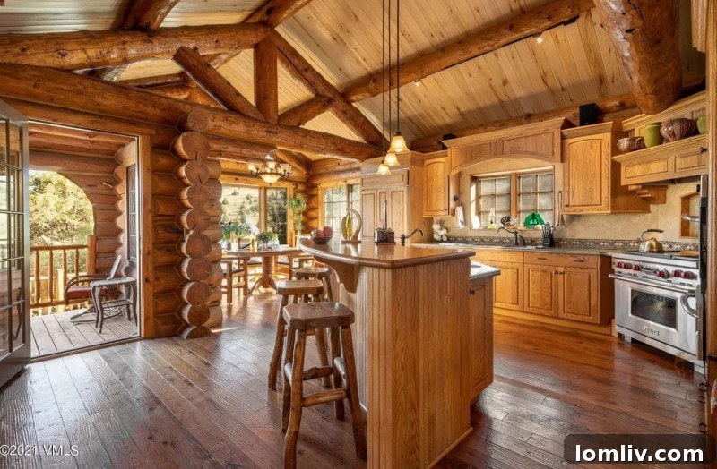 Luxurious rustic living room with stone fireplace and plush seating