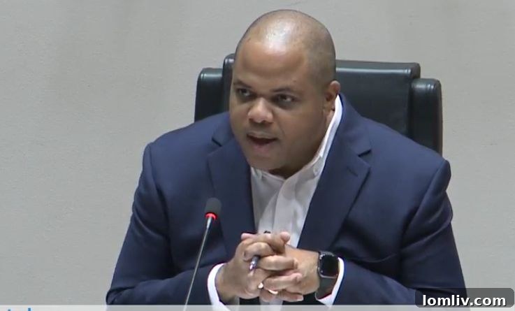 Dallas Mayor Eric Johnson stands at a podium, conveying authority during a public address.