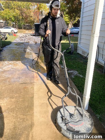 Alexander Steed with professional pressure washing equipment
