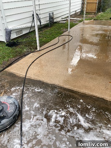 Pressure washing transforming a dirty driveway