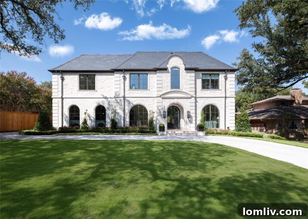 Elegant brick and stone exterior of the French Transitional home