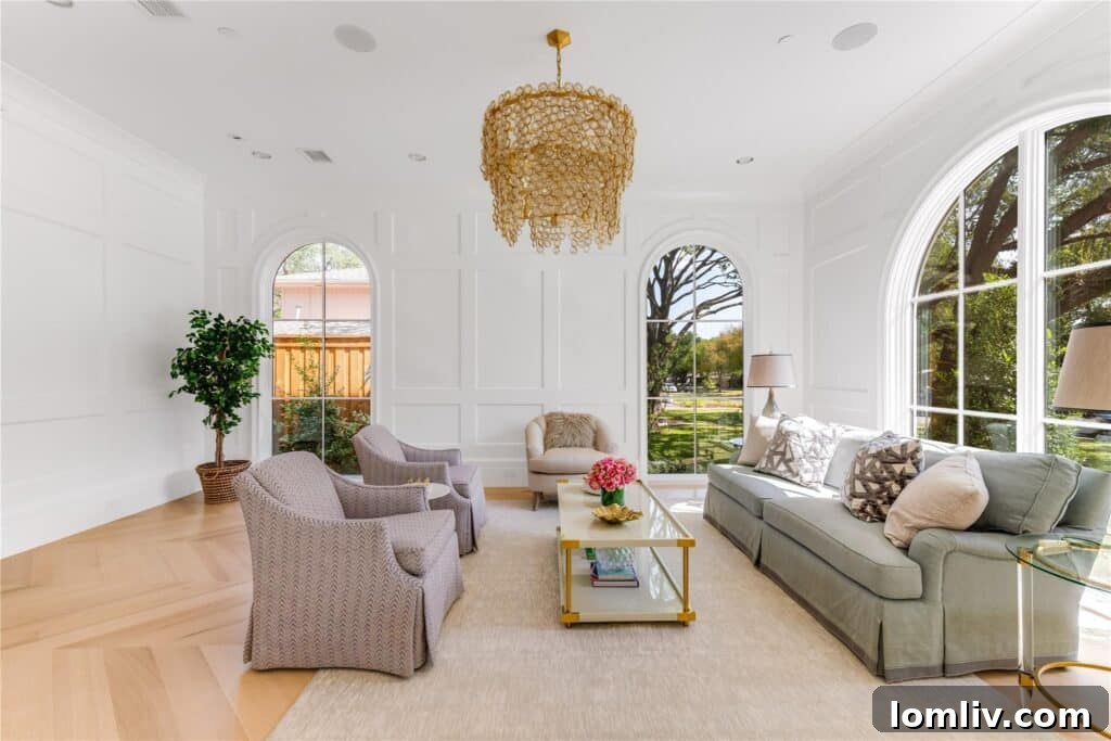Spacious formal living room with fireplace and elegant furnishings
