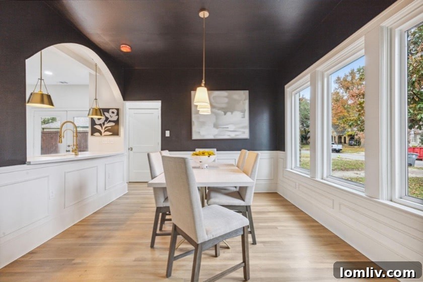 Black Paint and an Arch: The Magic Behind This M Streets Makeover 6 Sophisticated black dining room with archway to kitchen
