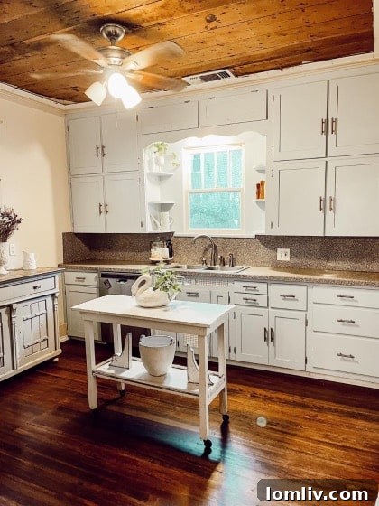 Live Your Gilmore Girl Dream in This Charming Historic McKinney Home 8 Updated Bathroom with Penny Tile and Wallpaper