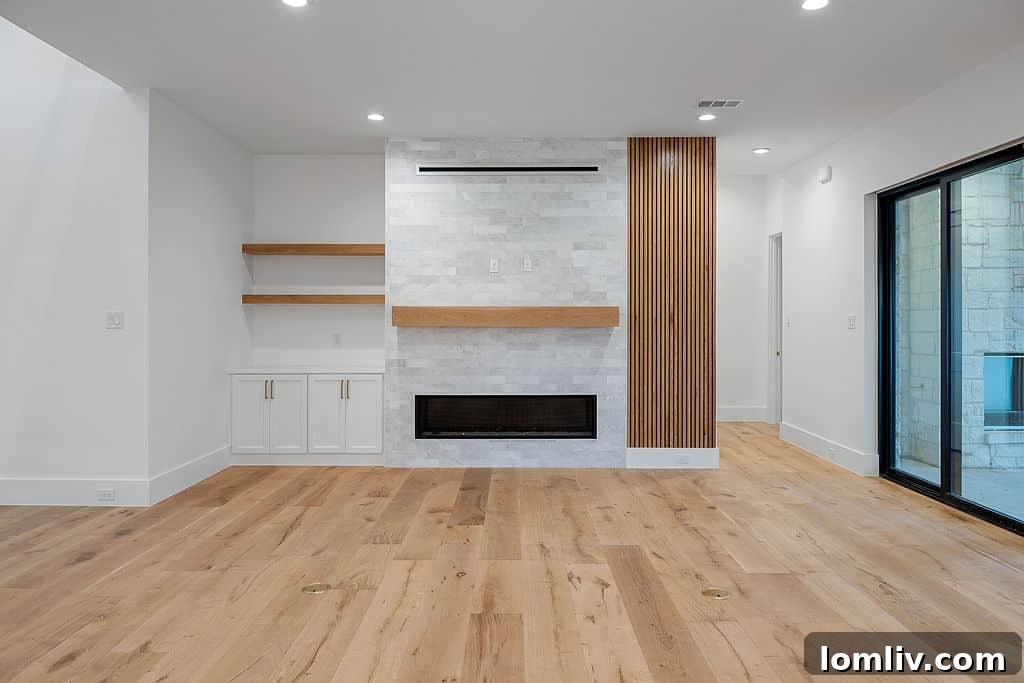 Spacious Modern Living Room with Elegant Fireplace and Natural Light