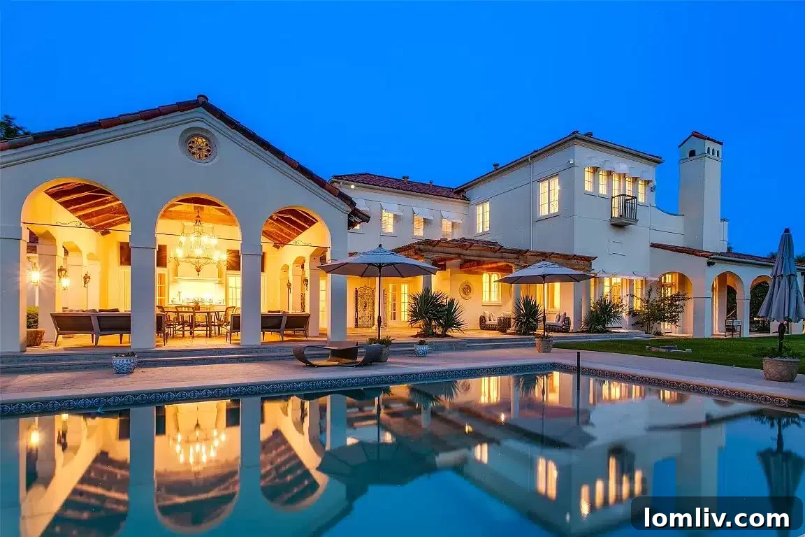 Backyard designed with old Hollywood glamour featuring a lap pool