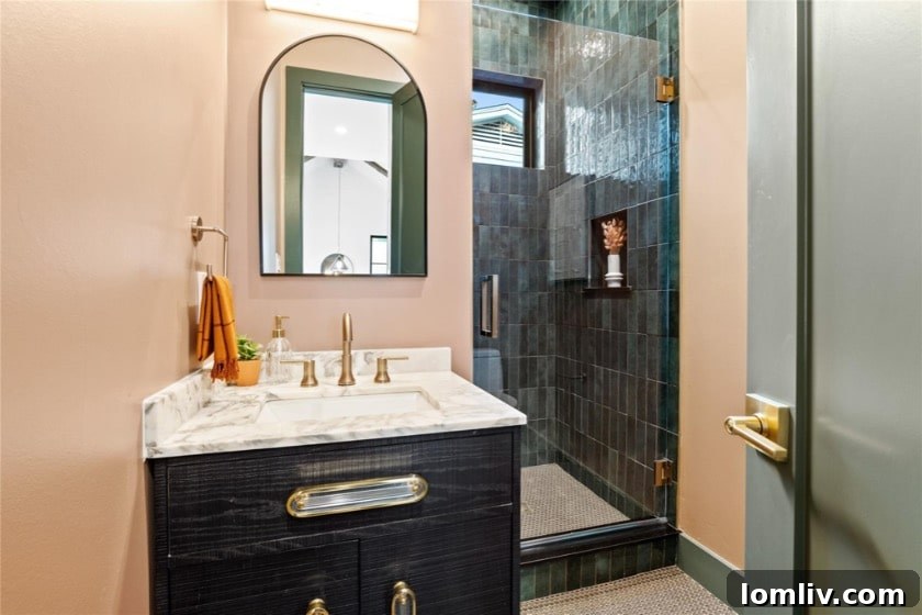 A bright and airy kitchen with white cabinetry, a spacious island, and elegant pendant lights, showcasing a blend of functionality and style.