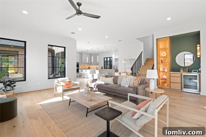 A luxurious primary bathroom featuring a freestanding tub, dual vanities, and a vintage-style door, exemplifying 5West Homes' attention to detail.