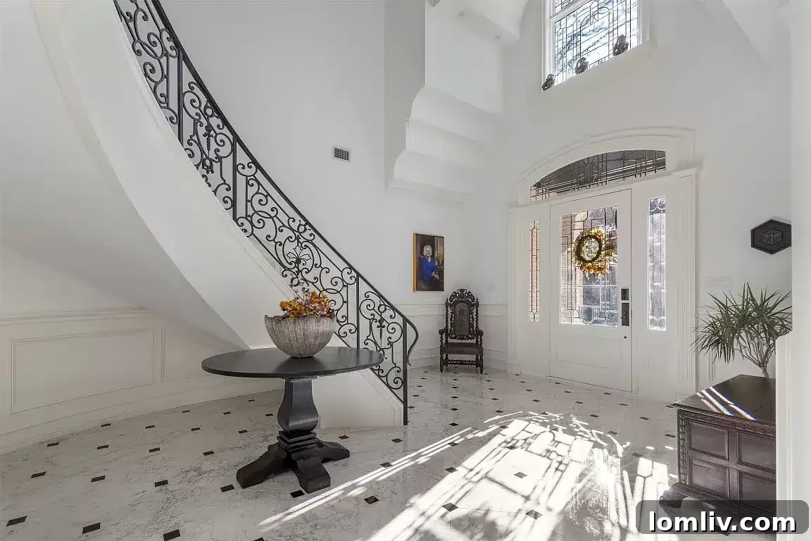 Grand foyer and wrap-around staircase at 2201 Hidden Creek Road