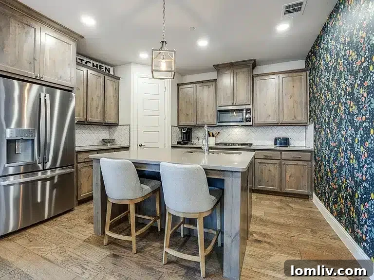 A stylish open-concept kitchen with a herringbone backsplash and granite counters, opening to the living area.