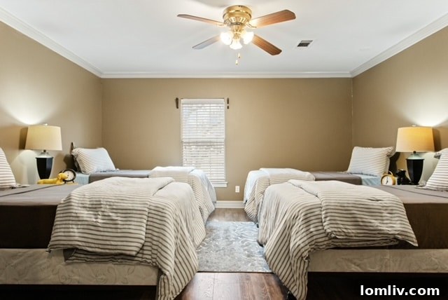 A bedroom in The Magdalen House Men’s Facility, featuring two comfortable beds and thoughtful decor.