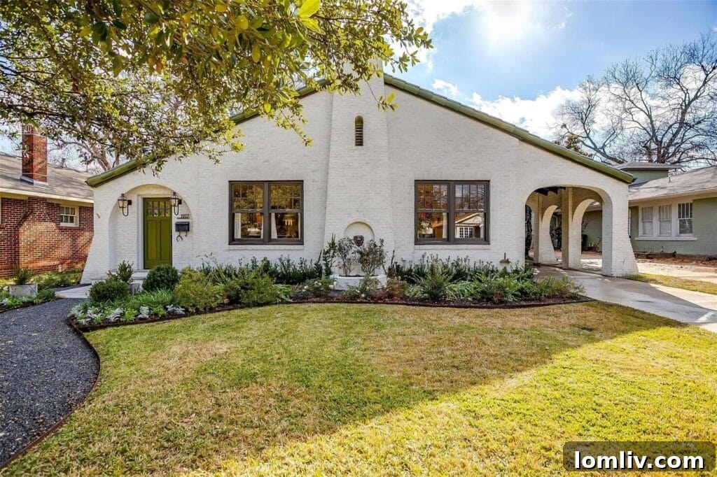 Charming Spanish Revival home with unique triangular facade in Berkley Place, Fort Worth.