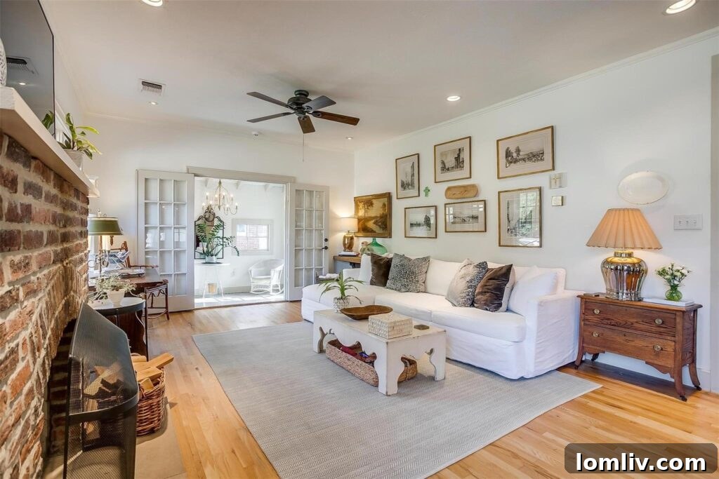 Spacious and airy living room with oak floors and antique furnishings in a renovated Berkley Place home.