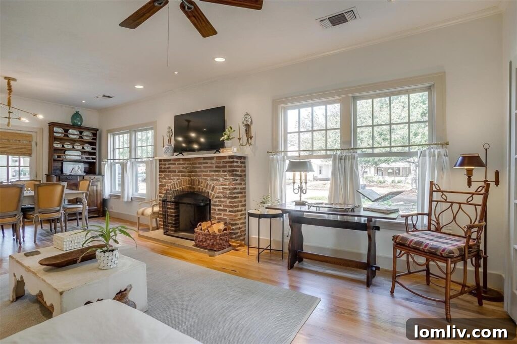 Elegant living space showcasing natural light and period-appropriate decor in a century-old Fort Worth house.
