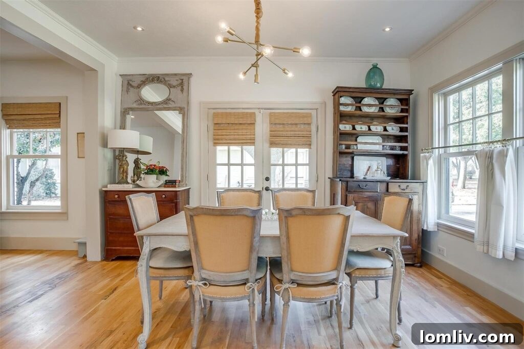 Detailed view of the living room featuring exquisite antique chairs and polished oak flooring.