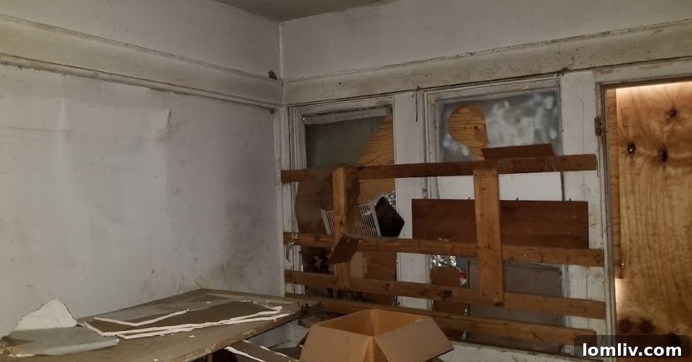 Bedroom before renovation, showing significant wear