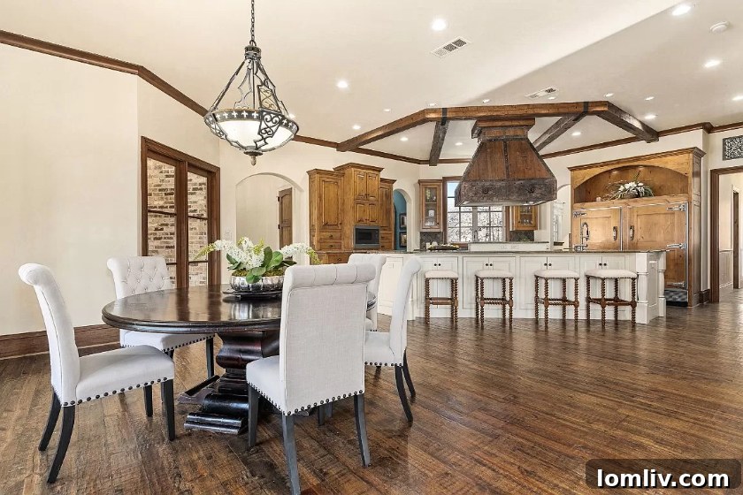 Warm and inviting living room with high vaulted ceilings and natural light in Argyle luxury home