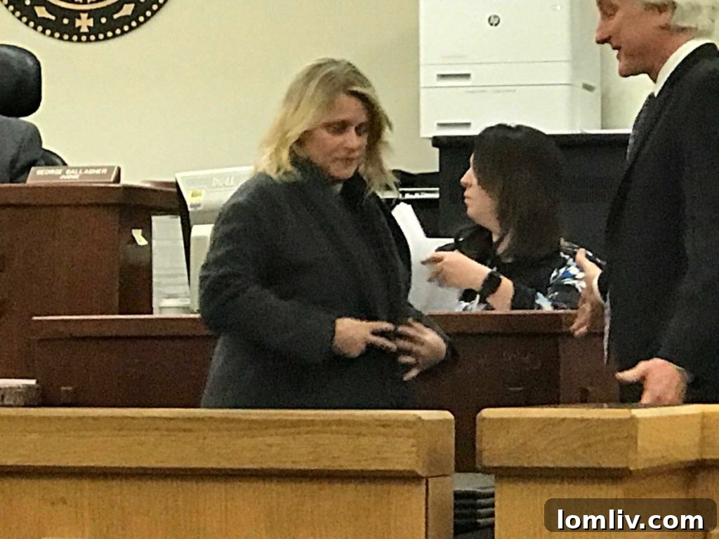 Nancy Carroll, also known as Nancy Jackson Spinks, leaving a Tarrant County courtroom in handcuffs