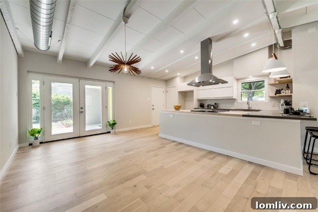 Bright and airy interior space, showcasing new, energy-efficient windows that flood the room with natural light.