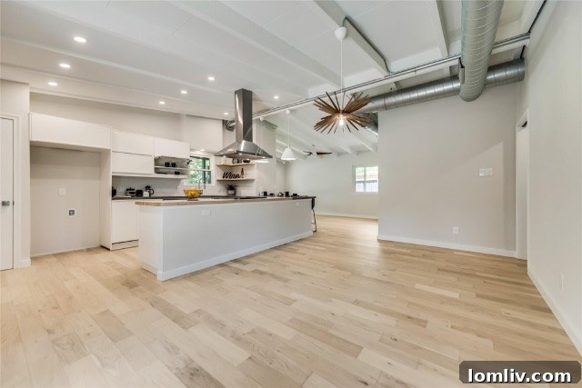 Gourmet kitchen featuring sleek Quartz countertops, a thick butcher block island, custom hand-painted cabinets, and modern appliances.