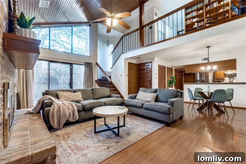 Living room with large windows, transom details, and a plant ledge
