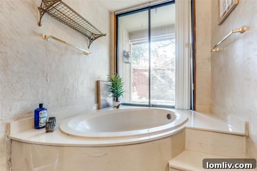 View of the open staircase and living area leading to the primary bedroom