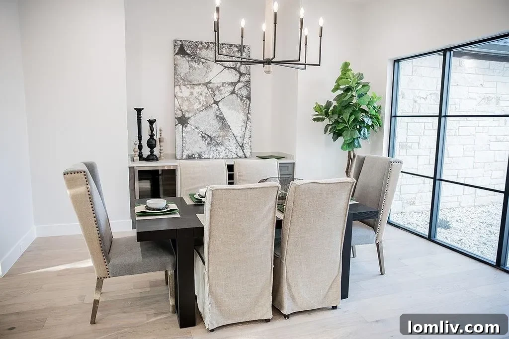 Close-up of the elegant custom front door and lighting at the Hideaway Lake luxury home