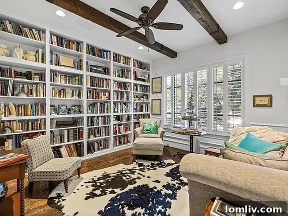 Library with expansive built-in shelves, perfect for displaying a large collection of trophies.