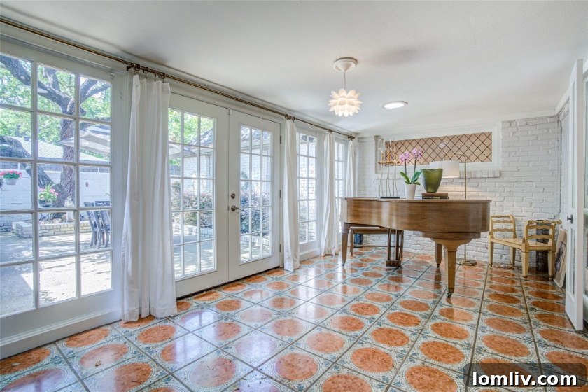 Before image of the sunroom, showing its original state with basic windows and minimal furnishing