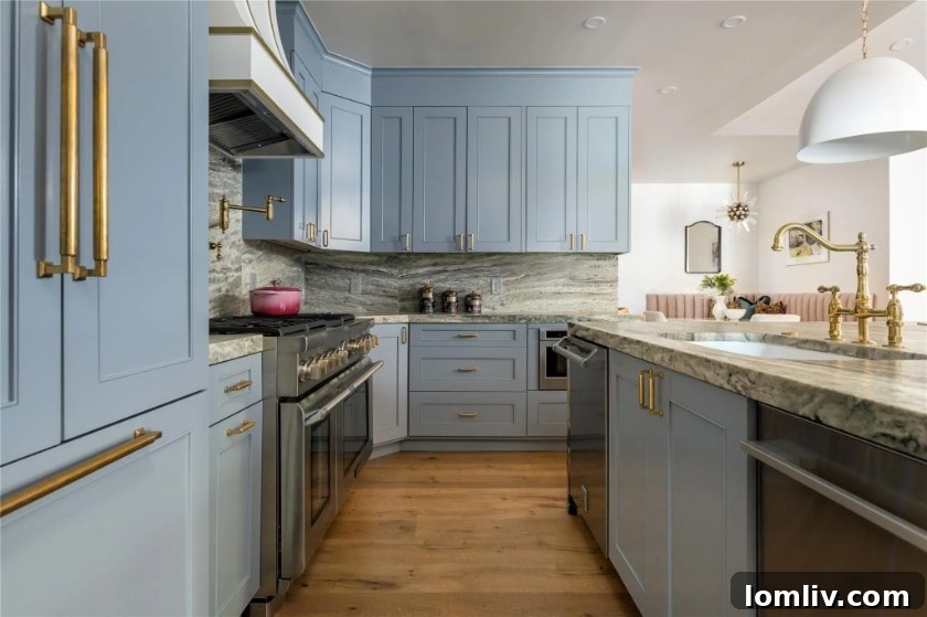 Modern kitchen featuring white cabinetry and a large window, enhancing natural light