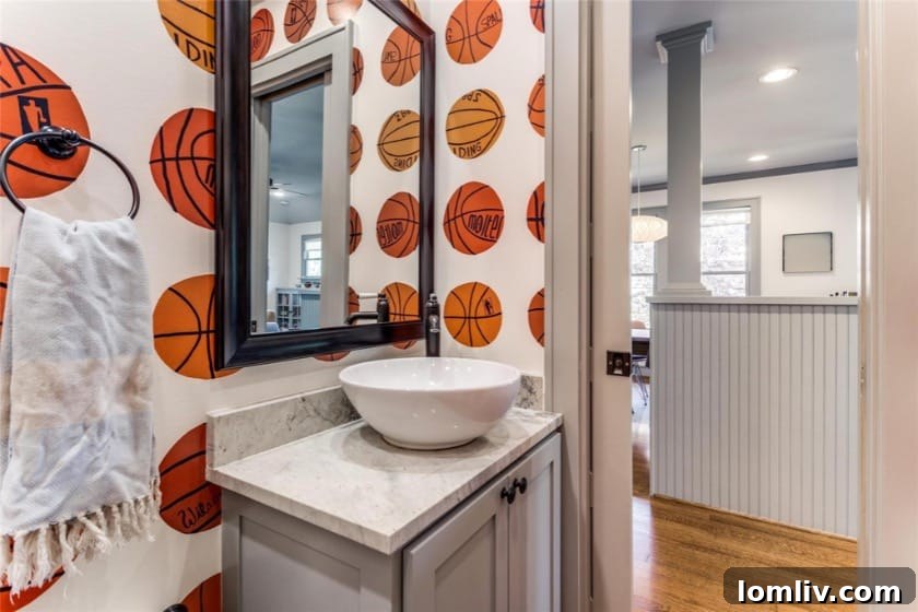 Luxurious bathroom with sleek fixtures and artistic wallpaper