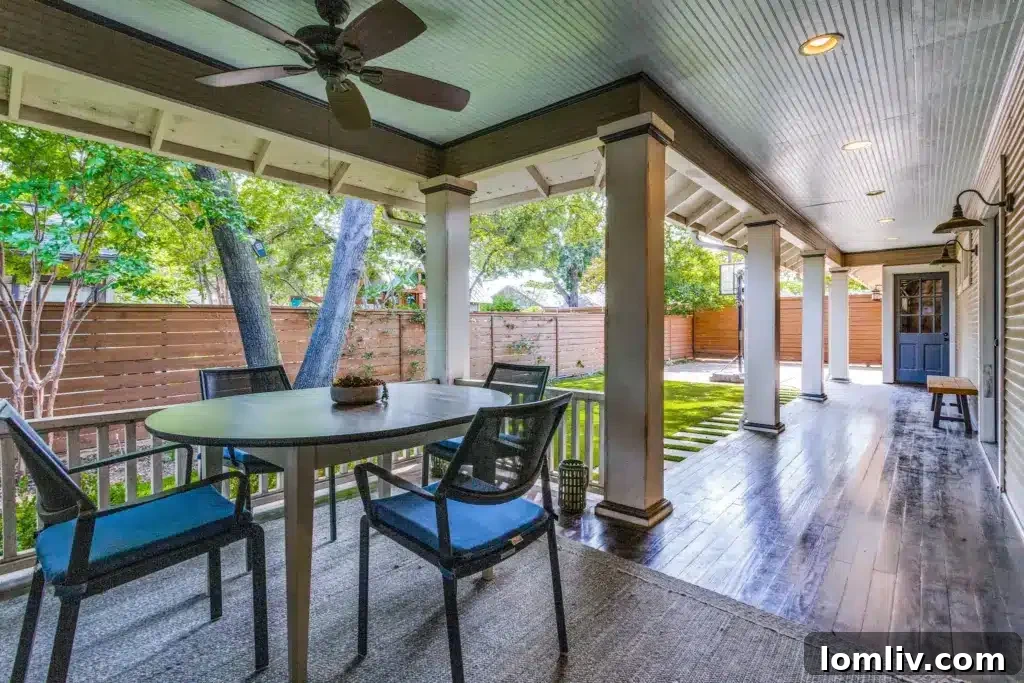 Beautifully landscaped backyard with turf and privacy fencing