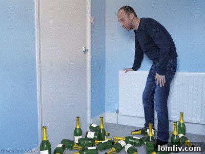 Exterior shot of the Arizona bottle house at twilight, with interior lights glowing through the glass bottles, creating a magical and inviting ambiance.