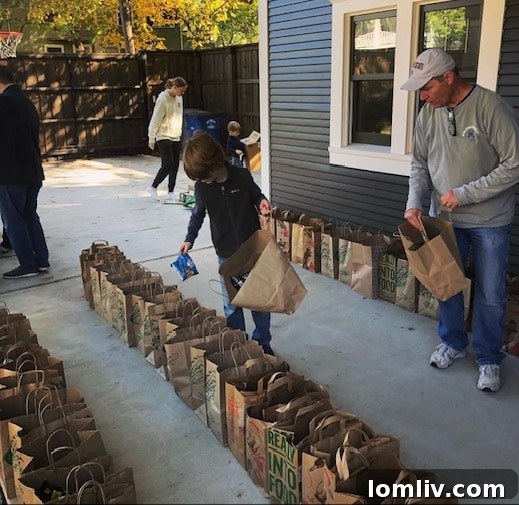 Volunteers prepare food bags for Lipscomb Elementary School students