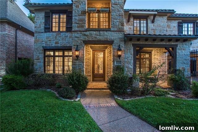 Warm and inviting living room with an oversized fireplace and hand-scraped hardwoods in a Lakewood home