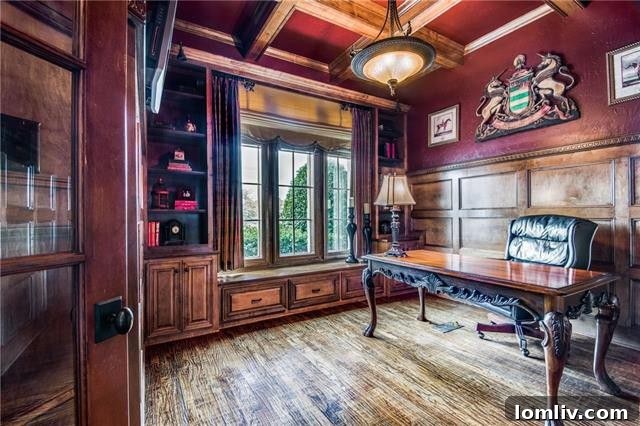 Spacious, inviting living area with a large stone fireplace and views of nature in Castle Hills