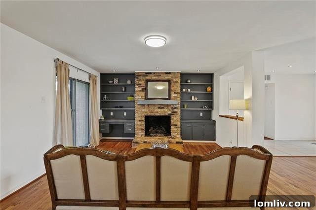 Another view of a bedroom with hardwood floors