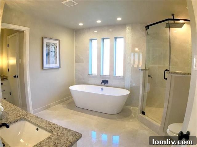 Well-appointed secondary bathroom with modern fixtures and finishes, reflecting the home's updated style