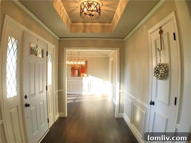 Bright and airy living room with vaulted ceilings and exposed beams in the Far North Dallas home at 16114 Fallkirk Drive