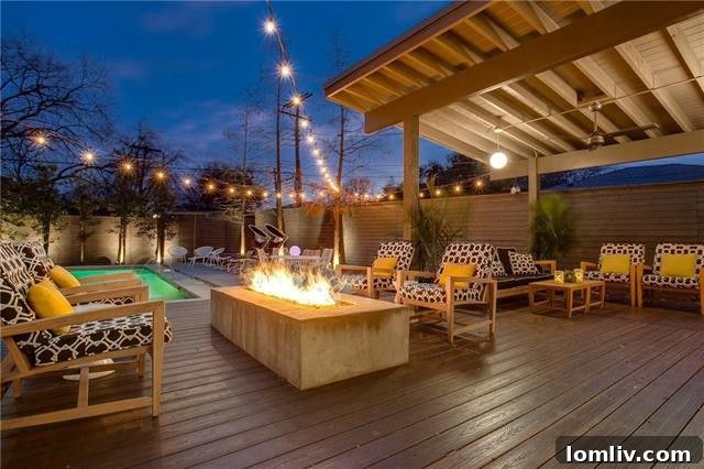 Inviting backyard pool and landscaped patio area of the Mid-Century Modern home