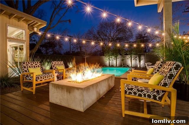 View of the pool area from a different angle, showing outdoor seating and garden