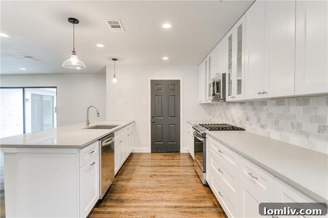 Sleek kitchen with quartz countertops and subway tile backsplash