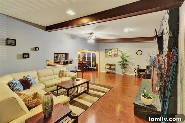 Spacious Living Room with Stone Fireplace and Vaulted Ceiling - 9459 Arborhill Dr