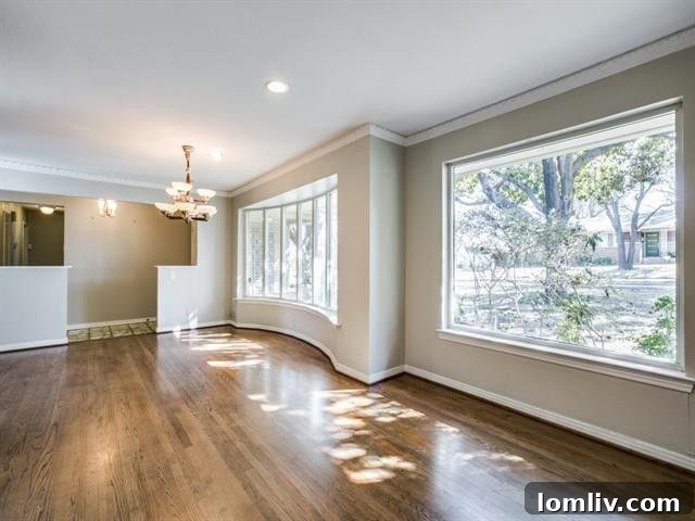 Merriman Park Masterpiece: Complete Living, Unmatched Price 4 Open concept living room featuring hardwood floors, recessed lighting, and ample natural light