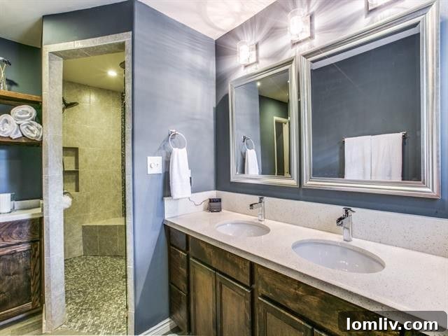 Merriman Park Masterpiece: Complete Living, Unmatched Price 9 Luxury master bathroom with quartz vanity, double sinks, and shimmering light fixtures