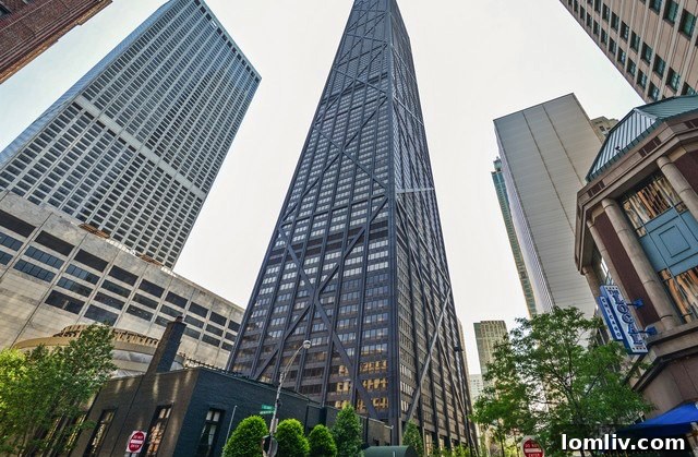 Hancock Center: Where Chicago's Sky Meets Earth in an Elemental Spectacle 2 The iconic John Hancock Center exterior, a symbol of Chicago's architectural prowess, towering over the city skyline.