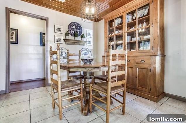 Cozy breakfast nook with beadboard ceiling and abundant natural light.