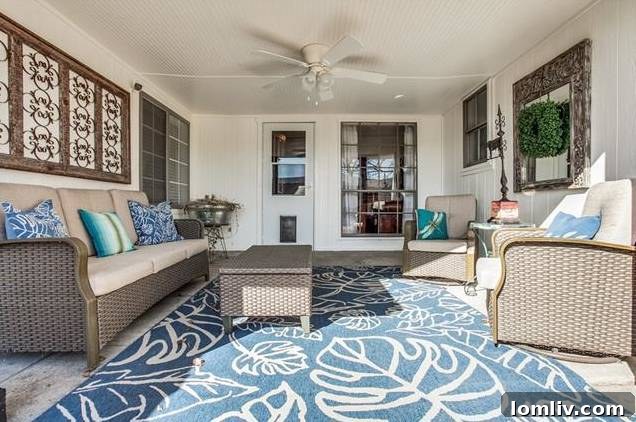 Spacious backyard with grassy lawn, covered patio, and children's playhouse.